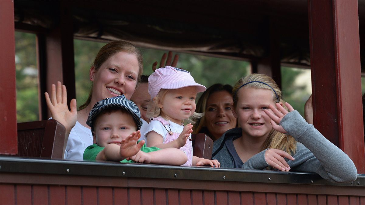 Mother and children looking out of the train window